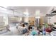 Cluttered garage with laundry area and stainless steel refrigerator at 9680 Ephesus Church Rd, Villa Rica, GA 30180