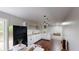 Modern kitchen featuring stainless steel appliances, white cabinetry, wooden counters, and hardwood flooring at 9680 Ephesus Church Rd, Villa Rica, GA 30180