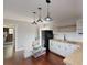 Charming kitchen with modern appliances, white cabinetry, wooden counters, and hardwood flooring at 9680 Ephesus Church Rd, Villa Rica, GA 30180