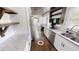 The kitchen has wooden ceiling, stainless appliances and white cabinets at 9680 Ephesus Church Rd, Villa Rica, GA 30180