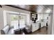 Cozy kitchen nook with a built-in bench, white cabinets, and hardwood floors at 9680 Ephesus Church Rd, Villa Rica, GA 30180