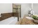 Bathroom with tub, shower and vanity with granite countertop at 1307 Madison Se Ln, Smyrna, GA 30080