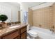 Well-lit bathroom features granite counters and a tiled shower-over-tub combination at 1307 Madison Se Ln, Smyrna, GA 30080