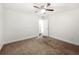 Neutral carpeted bedroom with ceiling fan and view to closet at 1307 Madison Se Ln, Smyrna, GA 30080