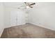 Carpeted bedroom offers a ceiling fan, ample closet space, and great natural light at 1307 Madison Se Ln, Smyrna, GA 30080