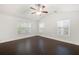 Bright bedroom with hardwood floors, a ceiling fan and multiple windows for ample natural light at 1307 Madison Se Ln, Smyrna, GA 30080