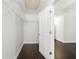 Walk-in closet with white wire shelving and hardwood floors at 1307 Madison Se Ln, Smyrna, GA 30080