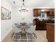 Cozy dining area features a modern chandelier, stylish rug, and seating for four at 1307 Madison Se Ln, Smyrna, GA 30080