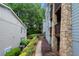 View of the side of the building with stone accents and pathway at 1307 Madison Se Ln, Smyrna, GA 30080