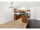 Well-lit kitchen featuring granite counters, tile floor, and stainless steel appliances at 1307 Madison Se Ln, Smyrna, GA 30080