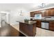 This kitchen features stainless steel appliances, a tiled backsplash, and granite countertops at 1307 Madison Se Ln, Smyrna, GA 30080