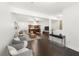 Open concept living room with hardwood floors, modern furniture and lots of natural light at 1307 Madison Se Ln, Smyrna, GA 30080