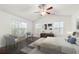 Cozy main bedroom with hardwood floors, a ceiling fan and multiple windows for ample natural light at 1307 Madison Se Ln, Smyrna, GA 30080