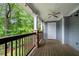 Relaxing covered patio with a ceiling fan and view of lush greenery at 1307 Madison Se Ln, Smyrna, GA 30080