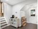 Finished basement landing area with coat hooks, and cabinet with drink prep station at 2377 Emory Ln, Marietta, GA 30068