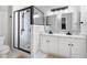 Bathroom features white subway tiles, a black framed glass shower and marble countertops at 2377 Emory Ln, Marietta, GA 30068