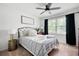 Inviting bedroom featuring a cozy bed, soft lighting, and a view of the outdoors at 2377 Emory Ln, Marietta, GA 30068