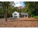 Traditional two-story home with a well-kept lawn surrounded by mature trees at 2377 Emory Ln, Marietta, GA 30068