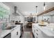 Spacious open-concept kitchen with a marble island, stainless appliances, and a clear view to the dining area at 2377 Emory Ln, Marietta, GA 30068
