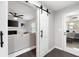 Bright living room is visible beyond a barn door at 2377 Emory Ln, Marietta, GA 30068