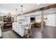 Expansive open-concept living space featuring a kitchen island, dining area, and comfortable living room at 2377 Emory Ln, Marietta, GA 30068