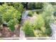 Aerial view of the home showcasing the in-ground pool, yard, and mature trees at 3383 Campbell Se Rd, Smyrna, GA 30080