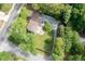 Aerial view of the property, highlighting the backyard with a patio, mature trees, and landscaping at 3383 Campbell Se Rd, Smyrna, GA 30080