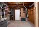 Unfinished basement featuring access door, exposed beams, and utilities at 3383 Campbell Se Rd, Smyrna, GA 30080