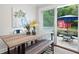 Bright dining area features sliding glass door and outdoor patio seating, ideal for enjoying indoor/outdoor dining at 3383 Campbell Se Rd, Smyrna, GA 30080