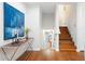 Inviting entryway with hardwood floors, a stylish console table, and a staircase leading to the upper level at 3383 Campbell Se Rd, Smyrna, GA 30080