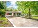 Charming home with a cozy covered porch, mature trees, and a long driveway at 3383 Campbell Se Rd, Smyrna, GA 30080