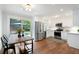 Eat-in kitchen features stainless appliances, white cabinetry, and sliding glass doors to a patio, offering modern convenience at 3383 Campbell Se Rd, Smyrna, GA 30080