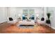 Bright living room features stylish decor, large windows, and a vibrant area rug, creating a welcoming atmosphere at 3383 Campbell Se Rd, Smyrna, GA 30080