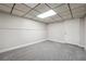 This basement is carpeted and has a door with a neutral color scheme at 798 Bankshire Dr, Suwanee, GA 30024