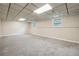 This basement is carpeted and has windows with a neutral color scheme at 798 Bankshire Dr, Suwanee, GA 30024