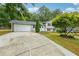 This home features a garage and a porch at 798 Bankshire Dr, Suwanee, GA 30024