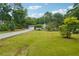 This home has a large front yard and a long driveway at 798 Bankshire Dr, Suwanee, GA 30024
