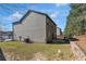 Home exterior featuring a spacious backyard, air conditioning unit, and mature trees, providing comfort and privacy at 820 Lake Chase, Fairburn, GA 30213
