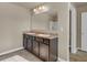 Bathroom featuring a double sink vanity with a large mirror and neutral walls and flooring at 820 Lake Chase, Fairburn, GA 30213