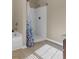 Bathroom showcasing a shower, bathtub, and neutral color scheme at 820 Lake Chase, Fairburn, GA 30213