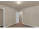Bedroom with a closet and doorway, neutral colors, creating a cozy atmosphere at 820 Lake Chase, Fairburn, GA 30213