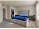 Spacious bedroom featuring neutral walls, carpet, and a large bed with a padded headboard at 820 Lake Chase, Fairburn, GA 30213