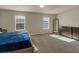 Spacious bedroom with two windows, providing ample natural light and carpeted floor at 820 Lake Chase, Fairburn, GA 30213
