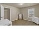 Bedroom with closet space and carpet, bathed in natural light from window at 820 Lake Chase, Fairburn, GA 30213