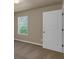 Bedroom with a window, ample natural light, carpet and neutral colors for relaxation at 820 Lake Chase, Fairburn, GA 30213