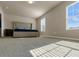 Bright bedroom with a large bed, natural light, and soft carpet, creating a cozy and inviting space at 820 Lake Chase, Fairburn, GA 30213