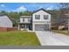 Charming two-story home featuring a covered front porch and a spacious two-car garage at 820 Lake Chase, Fairburn, GA 30213