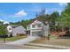 View of a well-maintained two-story home with a neat lawn and a two-car garage at 820 Lake Chase, Fairburn, GA 30213