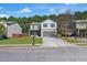 Charming two-story home featuring a covered front porch and a spacious two-car garage at 820 Lake Chase, Fairburn, GA 30213