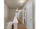 Hallway with neutral walls and carpet offers seamless transition between rooms at 820 Lake Chase, Fairburn, GA 30213